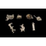 Collection of Seven Silver Charms comprising a hedgehog, a caterpillar on a leaf, a knight's helmet,