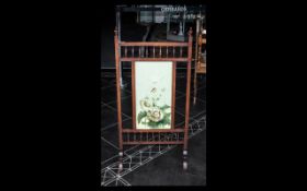 A Victorian Mahogany Fire Screen, the front with painted panel, square supports with turned gallery.