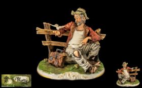 Capo-di-Monte Large Handpainted & Signed Porcelain Figure/Sculpture circa 1970. Tramp on a Bench