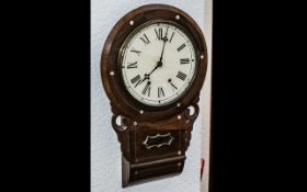 A Drop Dial Wall Clock rosewood case with mother of pearl inlay , tin dial with Roman Numerals.