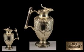 Metal Claret Jug/Ewer. 19th century work depicting Acanthus and floral designs.