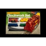 Hornby Railways Boxed Clockwork Set comprising 1/ 0-4-0 Clockwork Engine and key, 2/ Assorted