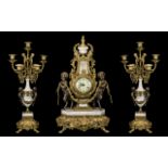 A 20th Century Brass And Marble Cased Clock Garniture In the Louis XV style,