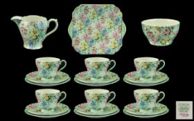 A Shelley 21 Piece Melody Tea Service comprising 6 trios, sugar, cream and bread and butter plate,