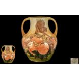 Moorcroft Large and Impressive Twin Handled Tube lined 'Fruits and Finches' Vase, with ochre ground,