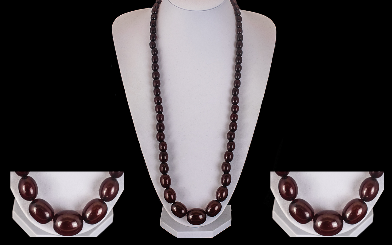 Early 20th Century Cherry Amber Long Graduated Bead Necklace of Excellent Quality. c.1920's.