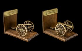 Pair of Brass Miniature Model Cannon Bookends, fitted on a wooden frame,