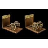 Pair of Brass Miniature Model Cannon Bookends, fitted on a wooden frame,