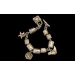 Danon Jewellery Solid and Chunky Silver Charm Bracelet, Loaded with 12 Silver Charms,