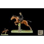 Beswick Hand painted Figure 'Hunts woman' Model No. 982. Designer L Harrington.