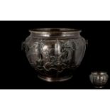 Large Antique Meiji Period Cast Bronze Jardiniere of fluted form with a bulbous body.
