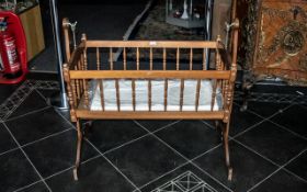 A 20th Century Babies Swinging Cradle mahogany finish, height 36", length 38".