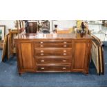 A Teak Modern Mahogany Sideboard with 4 fitted drawers containing a canteen of cutlery above two