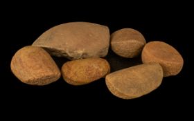 Five Stone Age Grinding Stones used on corn grinding, together with a piece from a grinding bowl,