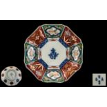 Antique Imari Plate with Chinese inscriptions to the centre.