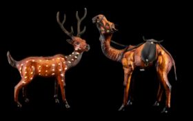 Two Realistically Modelled Figures of a Camel & Deer, leather clad, tallest 14".