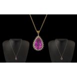 Ladies 9ct Gold Pear Shaped Amethyst Set Pendant Attached to a 9ct Gold Chain.