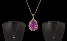 Ladies 9ct Gold Pear Shaped Amethyst Set Pendant Attached to a 9ct Gold Chain.