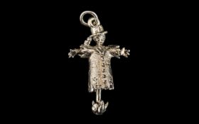 Silver Charm of a Scarecrow with moveable parts, and a bird sitting on his shoulder.