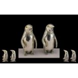 A Pair of Silver Novelty Salt and Pepper Pots In the Form of Penguins. Marked 800 Silver.