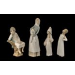 Four Lladro Figures to include a girl with lamb,