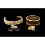 Antique Chinese Carved Boar's Tusk Necklace in the shape of a coiling dragon, a carved ivory netsuke