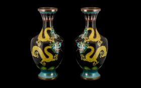 Pair of Chinese Cloisonne Vases decorated to the body with a swirling dragon chasing the pearl.