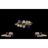 18ct Gold - Good Quality Sapphire and Diamond Set Dress Ring. Marked 750 - 18ct.