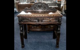 Late Victorian Green Man Carved Oak Side Table with a small shaped back,