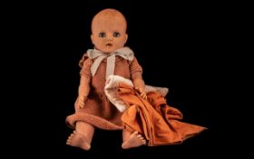 1960’s Baby Doll with small quantity of handmade baby clothes. Doll had moving sleeping eyes.