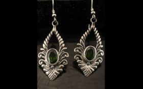 Russian Diopside Pendant Earrings, each earring having an oval cut solitaire Russian diopside of 1.