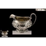 Georgian Period - Sterling Silver Embossed Cream Jug. Hallmark London 1822, Maker William Hewitt.