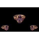 Rose de France Amethyst Fancy Mount Ring, an oval cut Rose de France amethyst of 5cts,