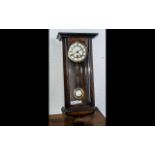 Small Vienna Wall Clock in Glazed Walnut Case, c1890s; white enamel dial with one key aperture,