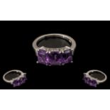 Amethyst and Diamond Band Ring, three octagon cut amethysts, totalling 4.