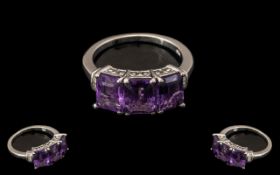 Amethyst and Diamond Band Ring, three octagon cut amethysts, totalling 4.