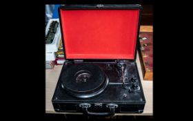 Portable Home Turntable made by Sainsbury's, in black hard shell carrying case. Please see images.