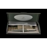 Boxed Parker Pen in silver grey with cartridges and original receipt, in hard shell case.