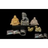 Small Collection of Chinese Carvings comprising a foo dog, two carved agate figures of Buddha,