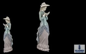 Lladro Handpainted Tall Porcelain Figurine 'Reading'.