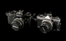 Two Cameras Nikon EL2-7924 702 Nikkor - 50mm 1.2 (EL), Olympus OM.1 F.Zuiko - Auto -S.
