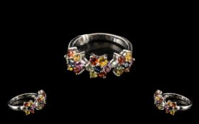 Rainbow Sapphire Floral Cluster Trilogy Ring, each flower set with green, golden yellow, citrus