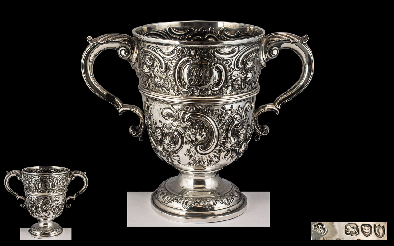 Victorian Period - Impressive and Fine Quality Sterling Silver Twin Handle Embossed Loving Cup.