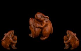 Japanese Early 20th Century Carved Boxwood Netsuke Depicts - A Field Mouse Holding a Fish.