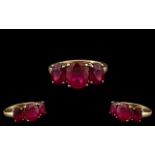 Ladies Attractive / Pleasing 9ct Gold - 3 Stone Ruby Set Dress Ring. The Rubies of Excellent Colour.