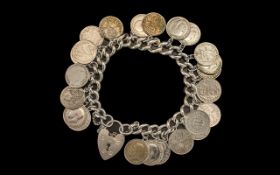 A Silver Curb Bracelet Loaded with 23 Silver Three Pences. Mostly Pre 1919, Some George V. 64.