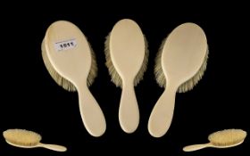 Three Early 20th Century Lady's Ivory Backed Hairbrushes.