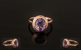 Rose de France Amethyst Solitaire Ring, a bezel set, oval cut,