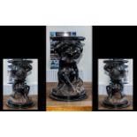 Italian Carved Wood Blackamoor, a crouching figure holding a plinth top, circa 1900s; 21 inches (52.