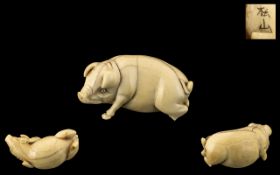 Japanese Meiji Period Carved Ivory Figure of a Pig, fully signed by the artist; originally of the